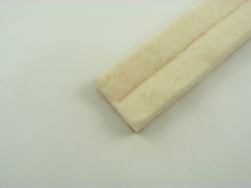 Upright treble damper felt creased, with red backing